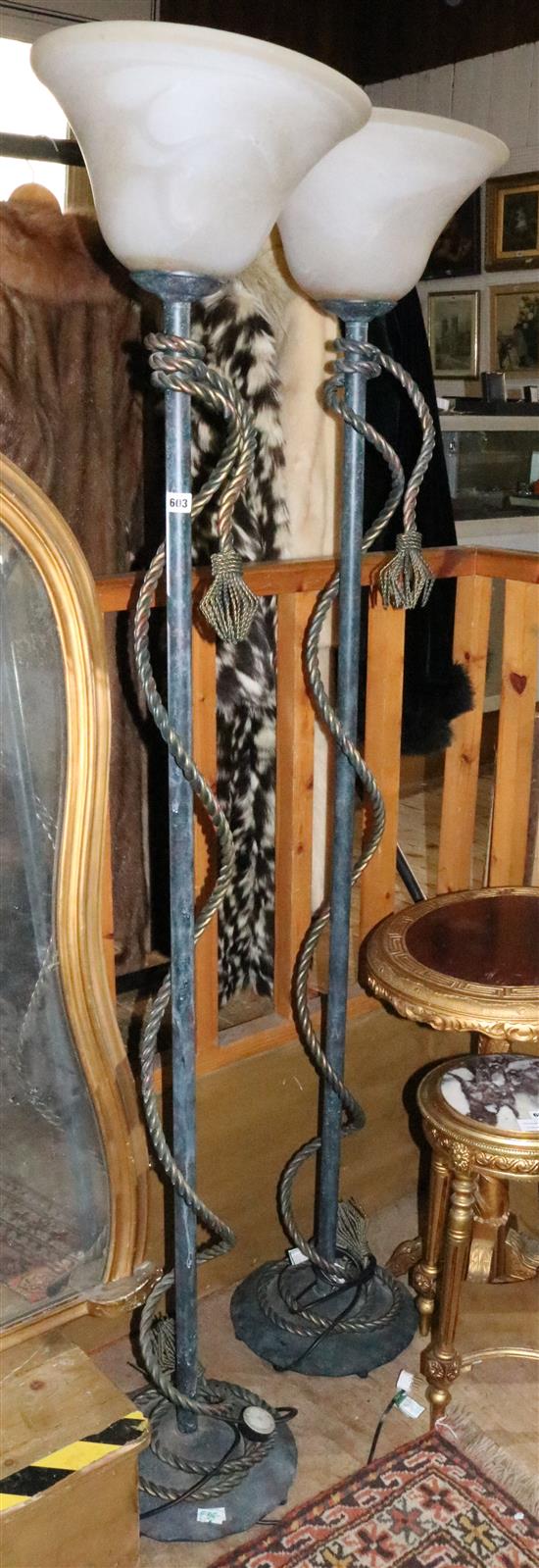 A pair of patinated metal ropetwist cord uplighters